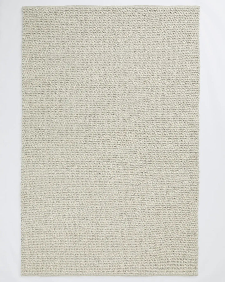 Emerson Seasalt - Luxurious Thick Rug Emerson Seasalt offers a soft, textured rug in a warm off-white tone, perfect for bedrooms and more with a durable cotton backing.