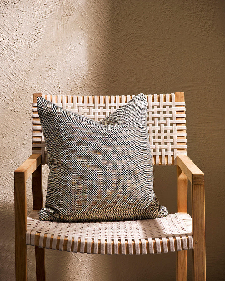 Nandi Cushion Create an outdoor sanctuary with the pared-back design of our Nandi cushion. Handwoven in a textural 1-1 weave, the Nandiâ€™s stylish taupe colourway is the perfect base upon which to mix-and-match cushion styles. Made from durable materials