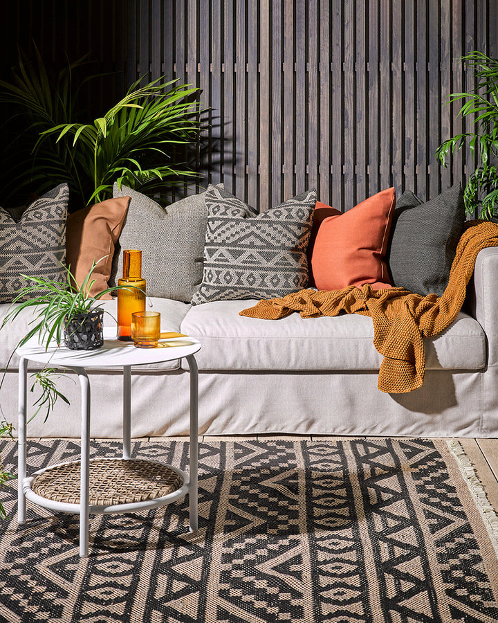 Nandi Cushion Create an outdoor sanctuary with the pared-back design of our Nandi cushion. Handwoven in a textural 1-1 weave, the Nandiâ€™s stylish taupe colourway is the perfect base upon which to mix-and-match cushion styles. Made from durable materials