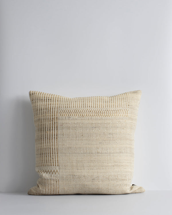 Navajo Cushion Constructed from sections of artisanal woven fabric, the Navajo is handcrafted using a stunning blend of wild tussar silk and spun wool. Celebrating natural fibres, the straw and ecru tones add a warm and artisan aesthetic to a space. Pair