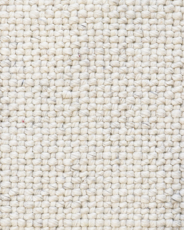 Nebraska Floor Rug Create a timeless living space with the with the beauty of this wool-blend floor rug in soft taupe. Handwoven in a simple 1-1 weave, the Nebraska adds warmth and interest with its subtle mottled tones and versatile structure. A staple f