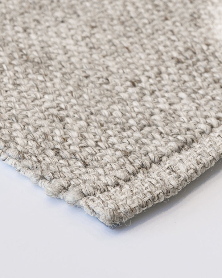 Nebraska Floor Rug Create a timeless living space with the with the beauty of this wool-blend floor rug in soft taupe. Handwoven in a simple 1-1 weave, the Nebraska adds warmth and interest with its subtle mottled tones and versatile structure. A staple f