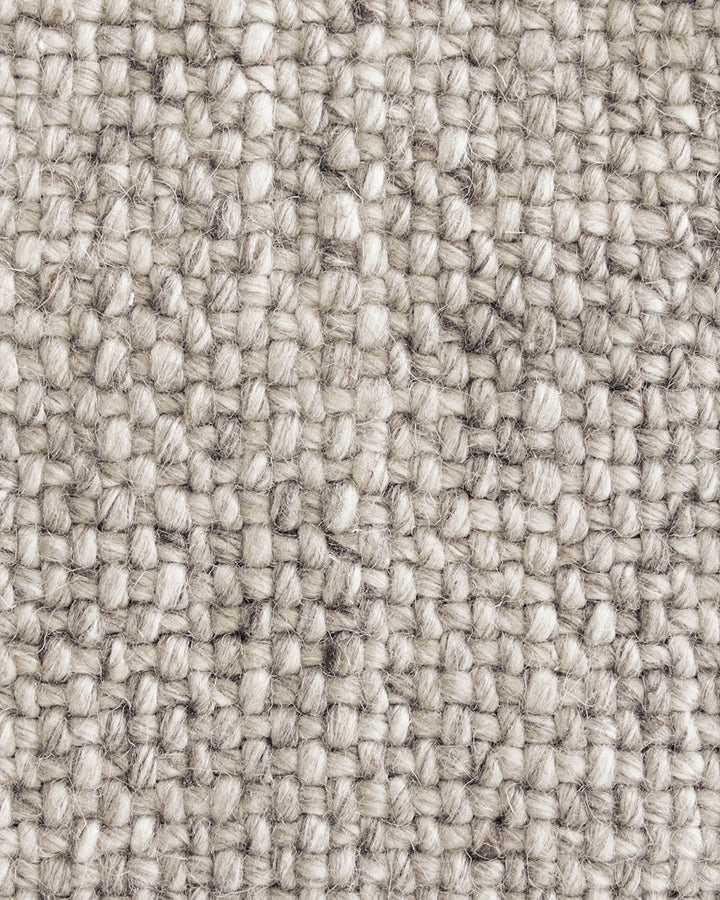 Nebraska Floor Rug Create a timeless living space with the with the beauty of this wool-blend floor rug in soft taupe. Handwoven in a simple 1-1 weave, the Nebraska adds warmth and interest with its subtle mottled tones and versatile structure. A staple f