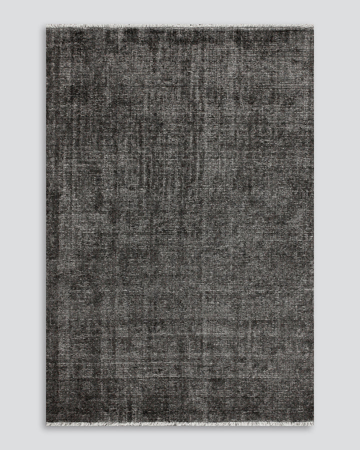 Nolan Floor Rug Hand-knotted from a velvety blend of bamboo silk and wool, the Nolan is perfect for formal living spaces and lavish bedrooms. Featuring a delicate short fringe and a soft mid-height pile, this understated floor rug is both simple and luxur