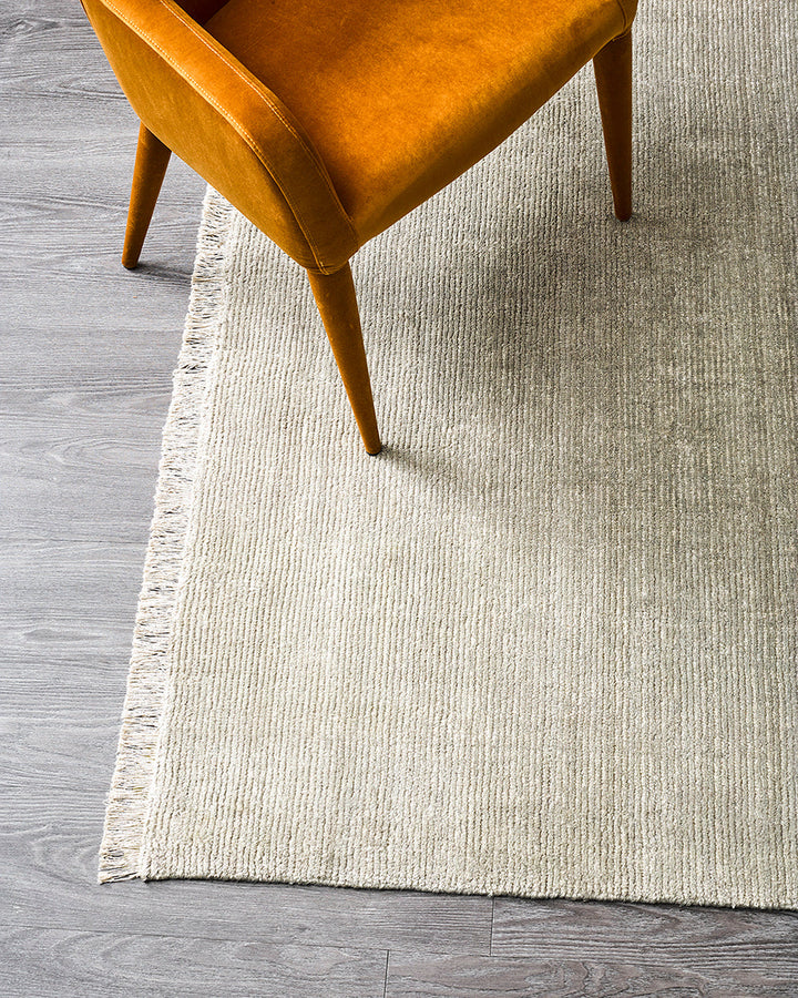 Nolan Floor Rug Hand-knotted from a velvety blend of bamboo silk and wool, the Nolan is perfect for formal living spaces and lavish bedrooms. Featuring a delicate short fringe and a soft mid-height pile, this understated floor rug is both simple and luxur