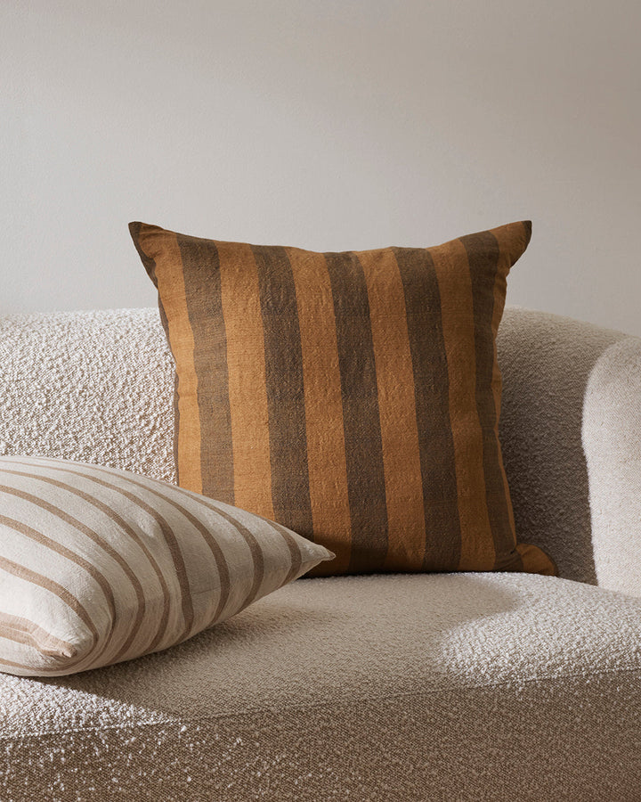 Noosa Cushion Invite rich earthen colour into your space with the two-tone stripe design of our Noosa cushion. Handwoven from a blend of natural fibres, the warm palette pairs effortlessly with tones in our core linen ranges. A restful piece that invites