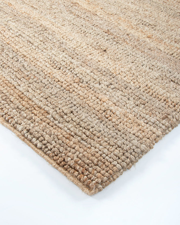 Papeete Floor Rug Handcrafted in a tight knot weave, the Papeete creates interest through raw texture and the golden lustre of natural jute. Beautifully rich and textural, this floor rug is an ideal choice for those wanting to achieve a pared-back and rel