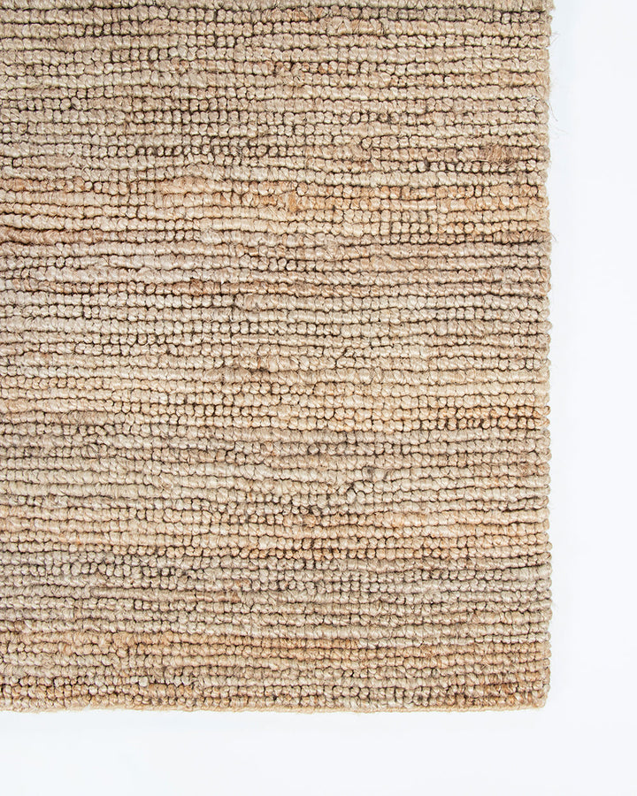 Papeete Floor Rug Handcrafted in a tight knot weave, the Papeete creates interest through raw texture and the golden lustre of natural jute. Beautifully rich and textural, this floor rug is an ideal choice for those wanting to achieve a pared-back and rel