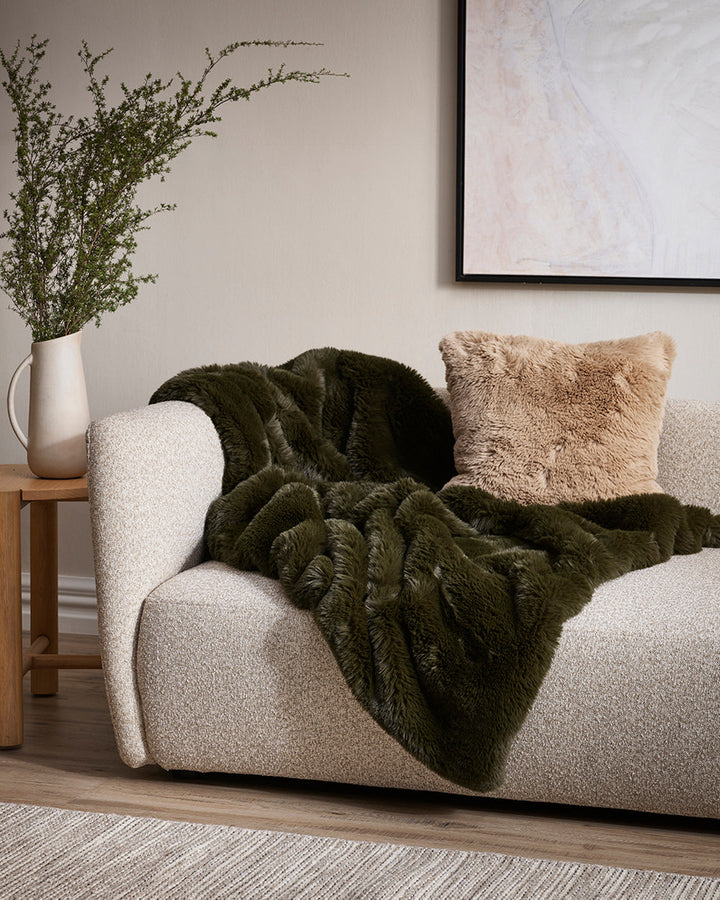 Pele Cushion Relax into the soft, plush pile of Pele faux fur. Crafted from dense strands of fur in a rich seaweed tone, these sumptuous pieces are designed to add a tactile, cosy aesthetic to your space. Irresistible to both look at and touch, this colou