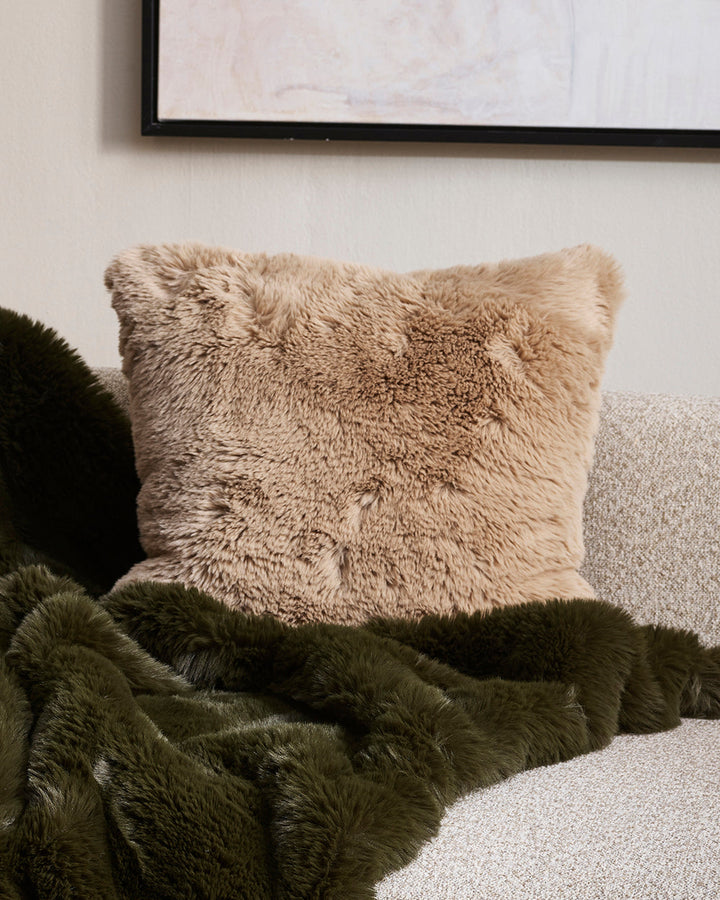 Pele Cushion Relax into the soft, plush pile of Pele faux fur. Crafted from dense strands of fur in a rich seaweed tone, these sumptuous pieces are designed to add a tactile, cosy aesthetic to your space. Irresistible to both look at and touch, this colou