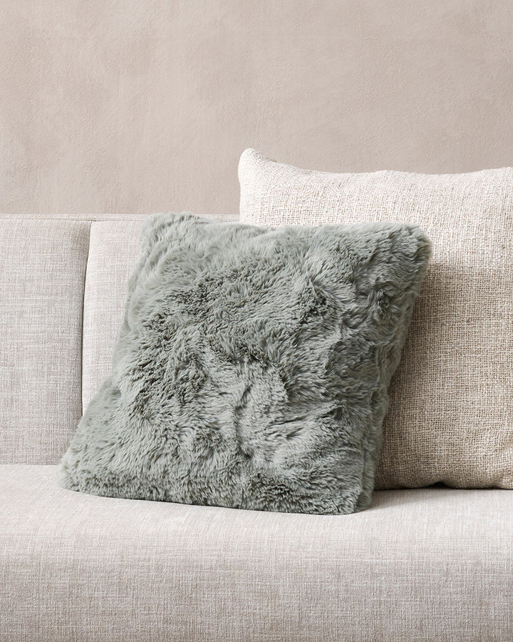 Pele Cushion Relax into the soft, plush pile of Pele faux fur. Crafted from dense strands of fur in a rich seaweed tone, these sumptuous pieces are designed to add a tactile, cosy aesthetic to your space. Irresistible to both look at and touch, this colou