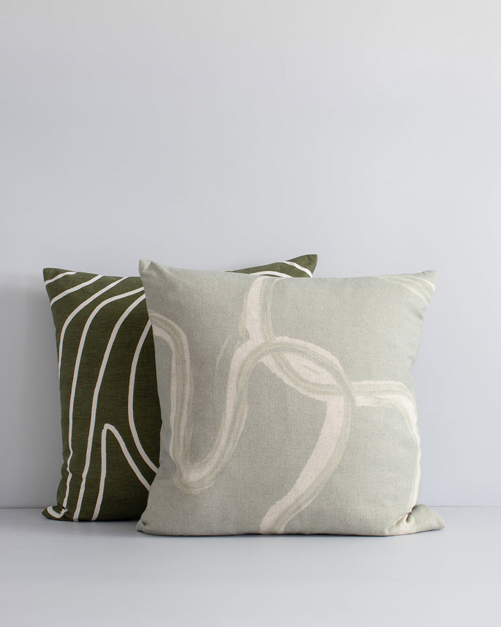 Machu Cushion A mindful, harmonious way of living is reflected in the design of this lichen-toned cushion. The flow of nature is depicted with subtle painterly lines, hand-drawn onto a linen-cotton base. Pair with ecru and moss tones to create a serene an