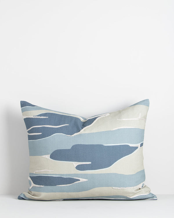 Reflections Cushion The undulating movement of water is captured in hues of blue and sand in this aquatic-inspired cushion. Printed onto a fine cotton base, elements of tufted embroidery add a subtle sensory dimension to this piece. Australian Stock Buy a