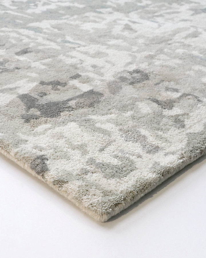 Reiner Floor Rug Inspired by dapple forms of shadow in nature, the Reiner has been handtufted by skilled artisans in a beautiful wool-viscose blend. Featuring a subtle shimmer, the soft underfoot pile and distinctive design makes this a key piece for crea