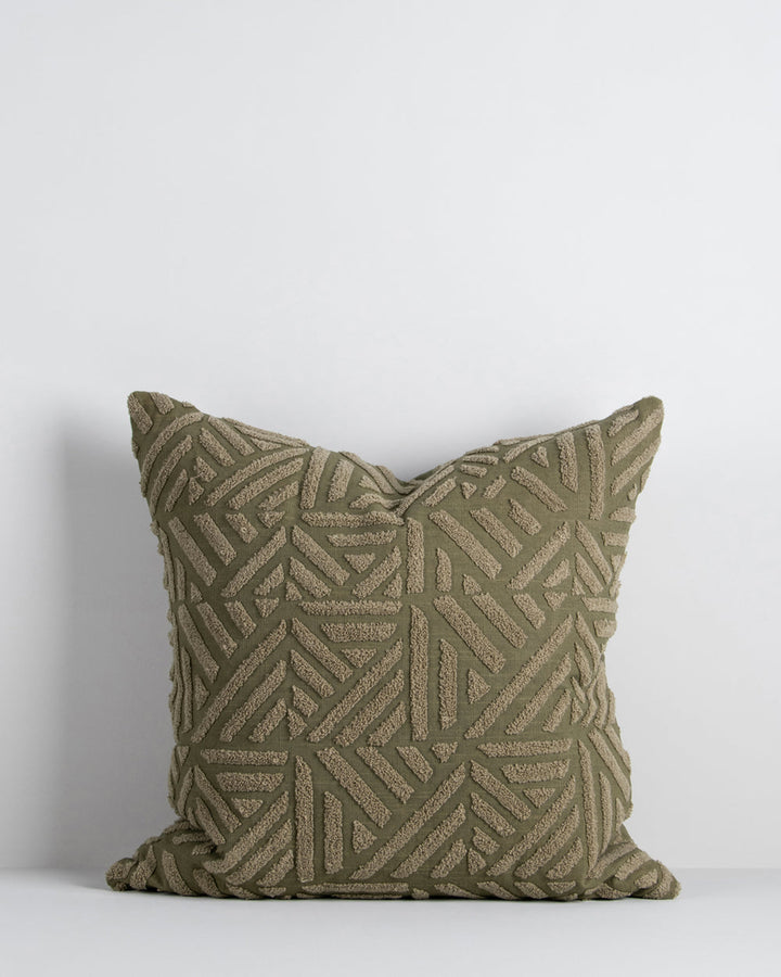 Remus Cushion Tufted embroidery on a natural base forms the texture on this relaxed and expressive cushion. Centred on a serene colour palette of ecru and taupe, the subtly tribal surface design looks great paired with finely woven linens in neutral and c