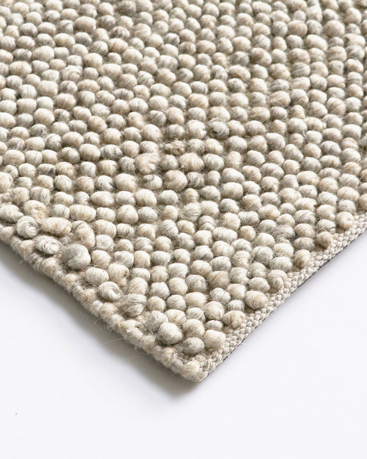 Roxburgh Floor Rug Bring a stylish and sophisticated feel to your space with the textured beauty of our Roxburgh floor rug. Carefully handmade, wool blend fibres are woven into tight bobbles, showcasing the fibreâ€™s tonal blends. An easy addition for any