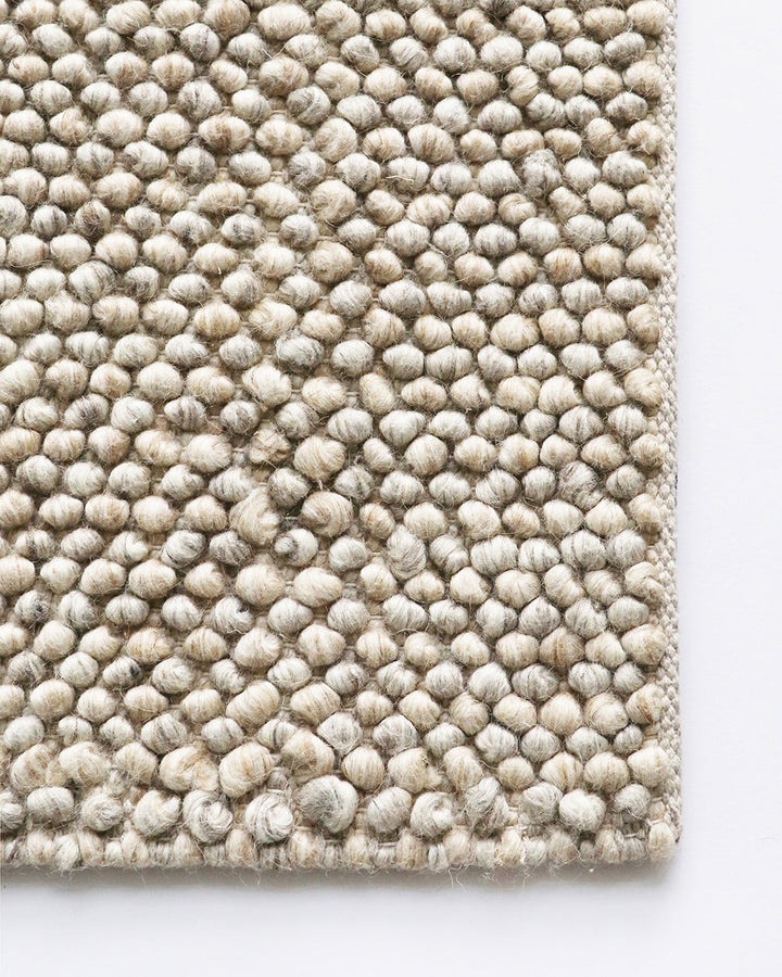 Roxburgh Floor Rug Bring a stylish and sophisticated feel to your space with the textured beauty of our Roxburgh floor rug. Carefully handmade, wool blend fibres are woven into tight bobbles, showcasing the fibreâ€™s tonal blends. An easy addition for any