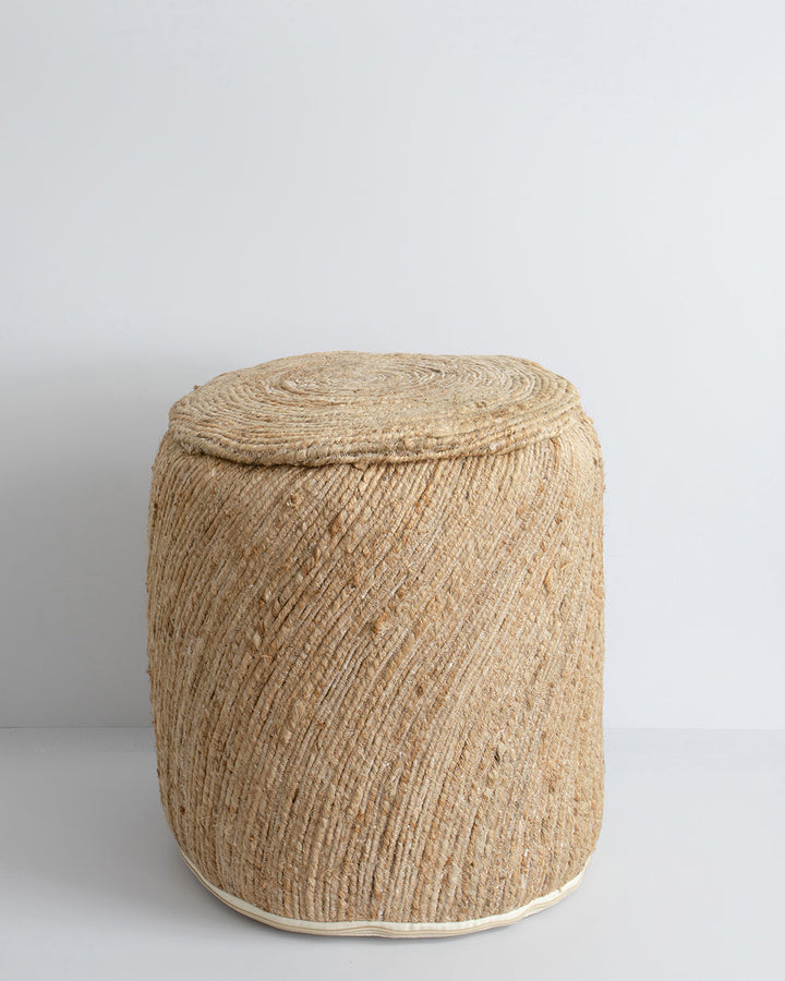 Rufus Ottoman Add texture to your space with the fluid design of this hard-wearing ottoman. Handcrafted from beautiful natural fibres, the simple design and warm straw tone makes this an essential building block for a comfortable and relaxed interior. An