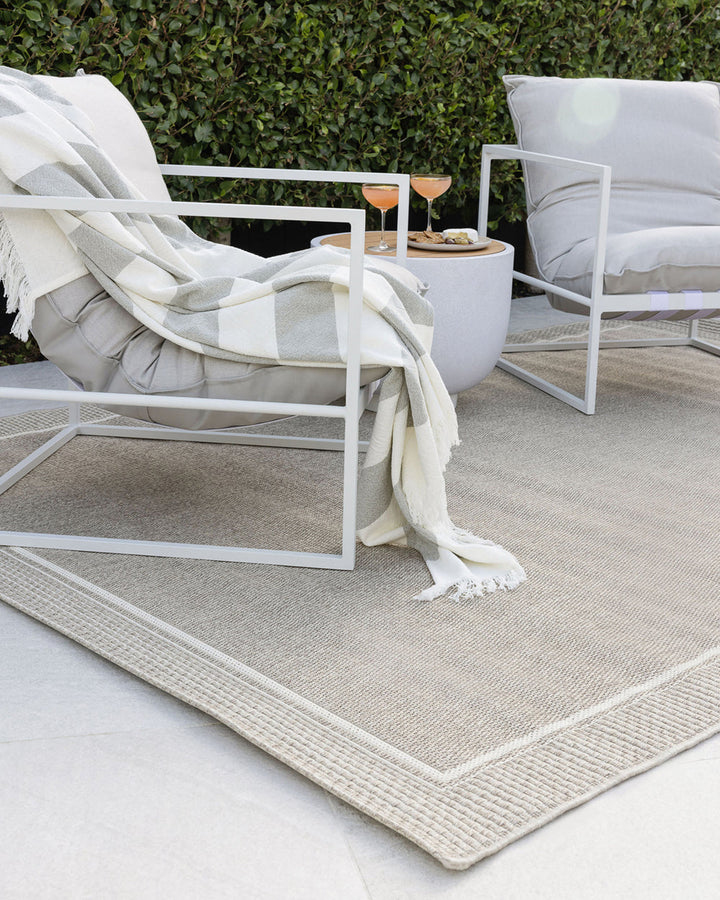 San Jose Floor Rug Featuring a simple weave and thick border design, the San Joseâ€™s soothing stone colourway provides the perfect base for styling a minimal and refined exterior space. The durable character of this piece make it perfect for outdoors, in