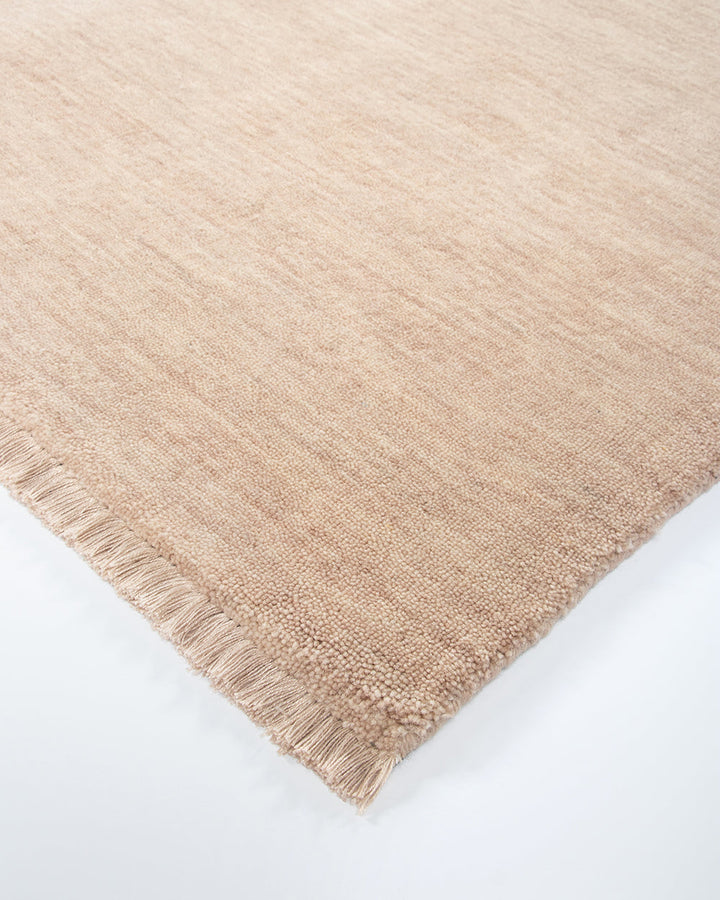 Sandringham Floor Rug Create a sophisticated sanctuary with the dense, sumptuous pile of the Sandringham. Soft and supportive underfoot, this floor rug is handknotted from 100% wool, featuring a cut pile and delicate fringing at both ends. The neutral fog