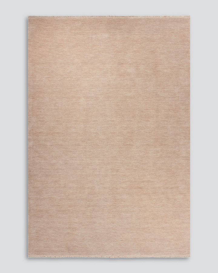 Sandringham Floor Rug Create a sophisticated sanctuary with the dense, sumptuous pile of the Sandringham. Soft and supportive underfoot, this floor rug is handknotted from 100% wool, featuring a cut pile and delicate fringing at both ends. The neutral fog