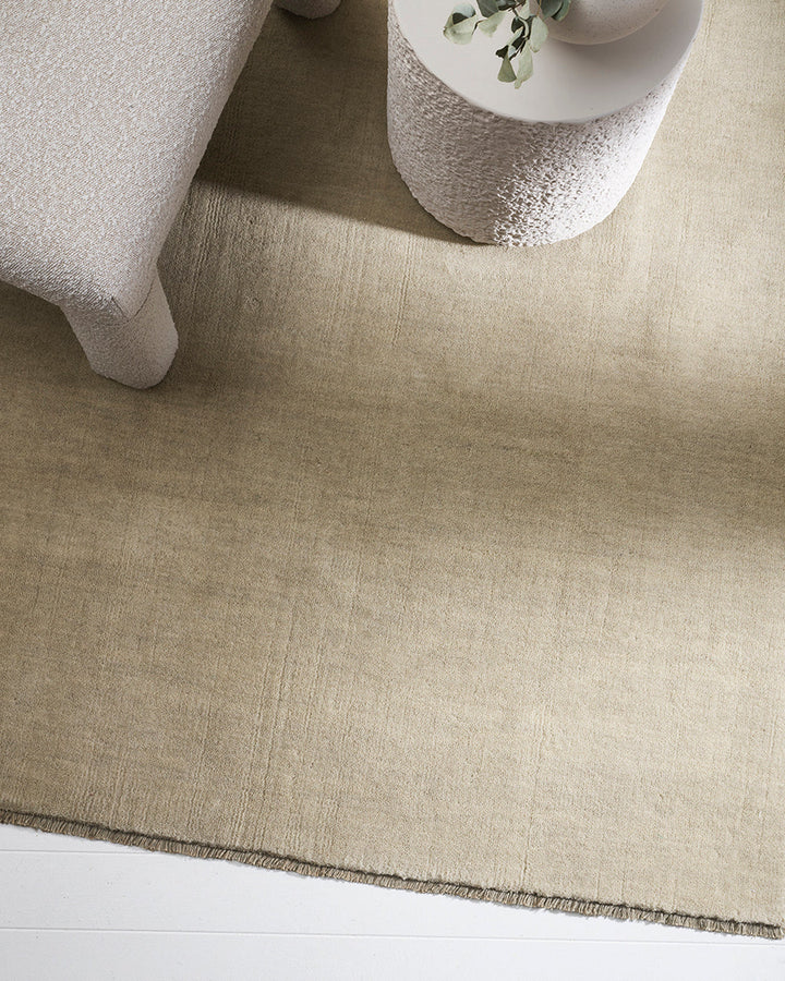 Sandringham Floor Rug Create a sophisticated sanctuary with the dense, sumptuous pile of the Sandringham. Soft and supportive underfoot, this floor rug is handknotted from 100% wool, featuring a cut pile and delicate fringing at both ends. The neutral fog