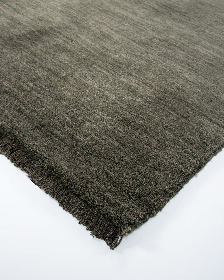 Sandringham Floor Rug Create a sophisticated sanctuary with the dense, sumptuous pile of the Sandringham. Soft and supportive underfoot, this floor rug is handknotted from 100% wool, featuring a cut pile and delicate fringing at both ends. The neutral fog