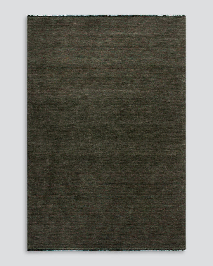 Sandringham Floor Rug Create a sophisticated sanctuary with the dense, sumptuous pile of the Sandringham. Soft and supportive underfoot, this floor rug is handknotted from 100% wool, featuring a cut pile and delicate fringing at both ends. The neutral fog