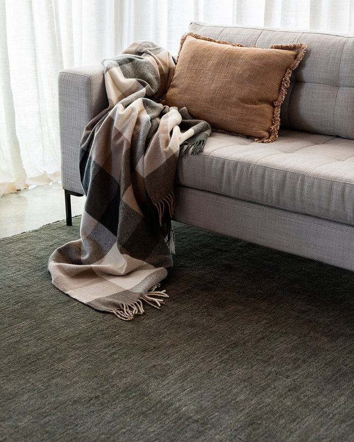 Sandringham Floor Rug Create a sophisticated sanctuary with the dense, sumptuous pile of the Sandringham. Soft and supportive underfoot, this floor rug is handknotted from 100% wool, featuring a cut pile and delicate fringing at both ends. The neutral fog