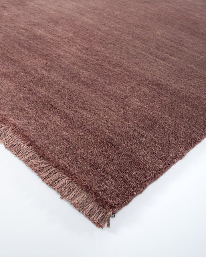 Sandringham Floor Rug Create a sophisticated sanctuary with the dense, sumptuous pile of the Sandringham. Soft and supportive underfoot, this floor rug is handknotted from 100% wool, featuring a cut pile and delicate fringing at both ends. The neutral fog
