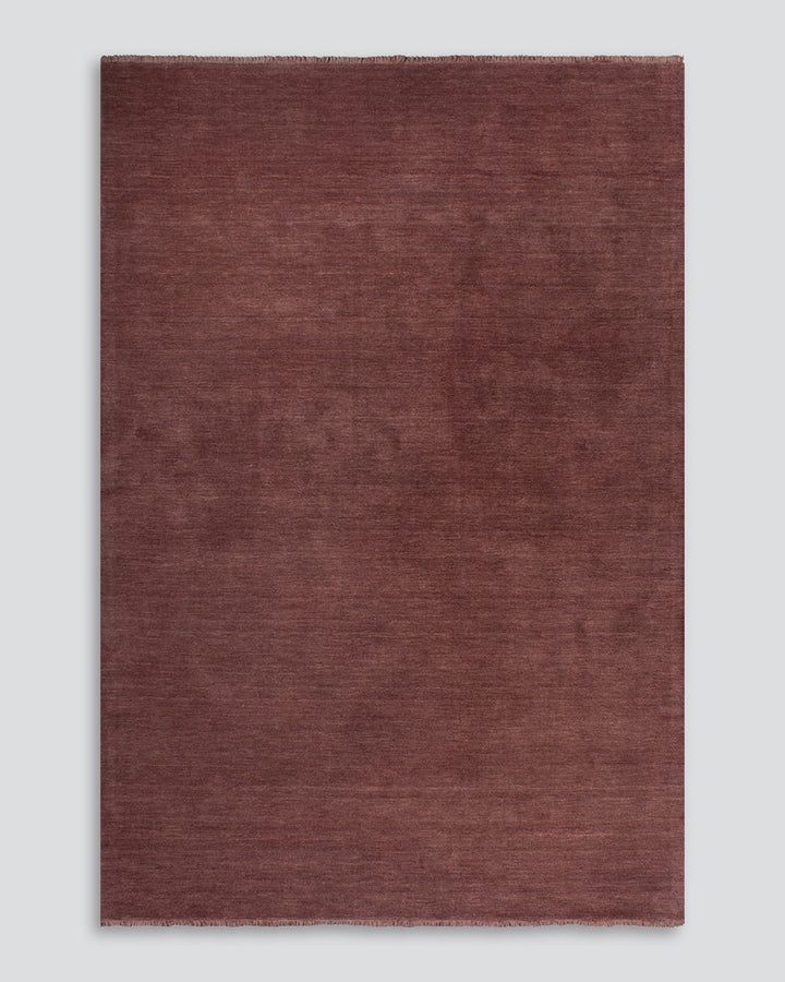 Sandringham Floor Rug Create a sophisticated sanctuary with the dense, sumptuous pile of the Sandringham. Soft and supportive underfoot, this floor rug is handknotted from 100% wool, featuring a cut pile and delicate fringing at both ends. The neutral fog