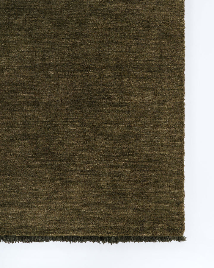 Sandringham Floor Rug Create a sophisticated sanctuary with the dense, sumptuous pile of the Sandringham. Soft and supportive underfoot, this floor rug is handknotted from 100% wool, featuring a cut pile and delicate fringing at both ends. The neutral fog