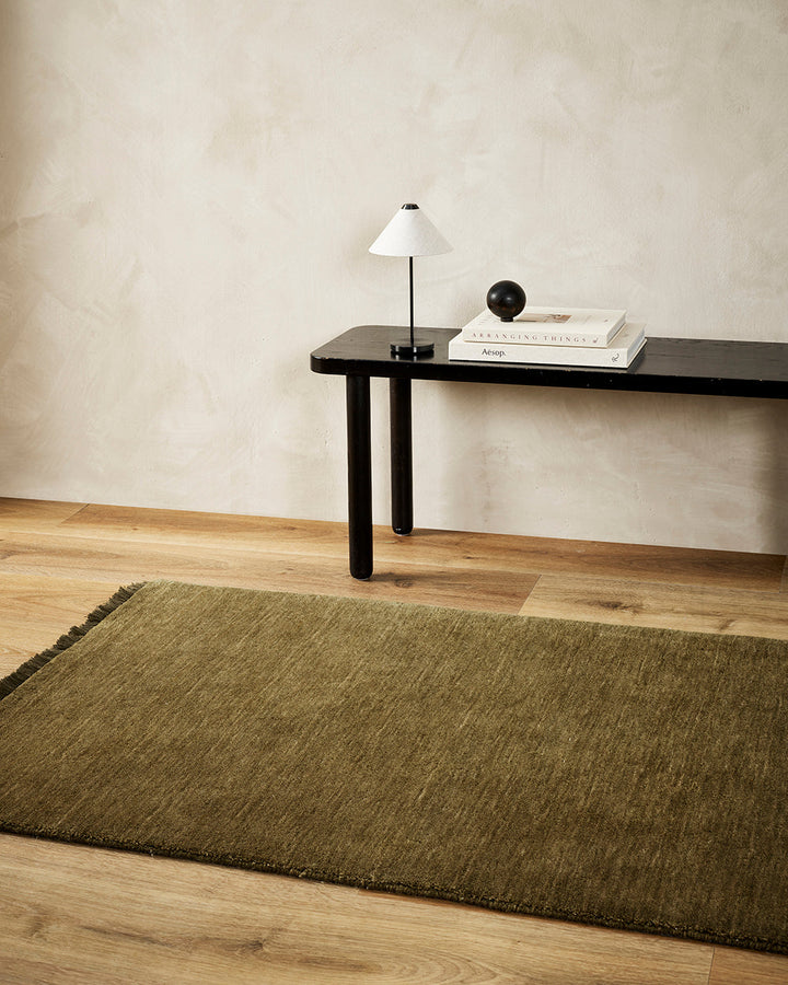 Sandringham Moss Floor Runner Handcrafted from 100% wool, this warm-toned Sandringham runner is both functional and beautiful, offering an unparalleled softness underfoot, while imbuing your hallway with tone and personality. Baya