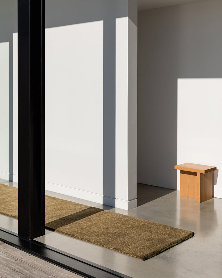 Sandringham Moss Floor Runner Handcrafted from 100% wool, this warm-toned Sandringham runner is both functional and beautiful, offering an unparalleled softness underfoot, while imbuing your hallway with tone and personality. Baya
