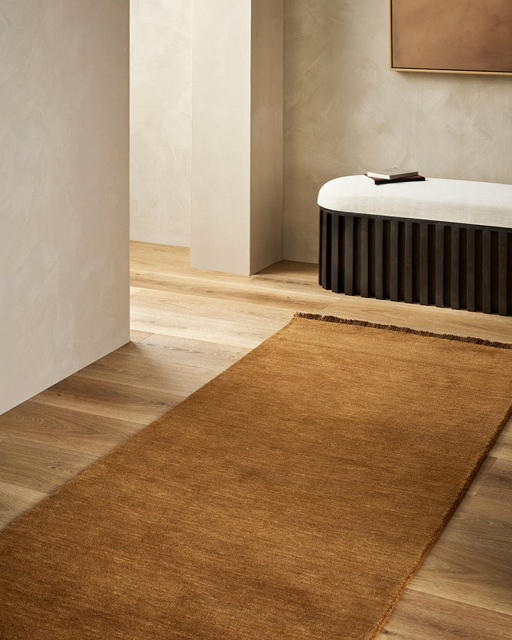 Sandringham Pecan Floor Runner Handcrafted from 100% wool, this warm-toned Sandringham runner is both functional and beautiful, offering an unparalleled softness underfoot, while imbuing your hallway with tone and personality. Baya