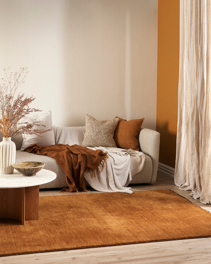 Sandringham Floor Rug Create a sophisticated sanctuary with the dense, sumptuous pile of the Sandringham. Soft and supportive underfoot, this floor rug is handknotted from 100% wool, featuring a cut pile and delicate fringing at both ends. The neutral fog