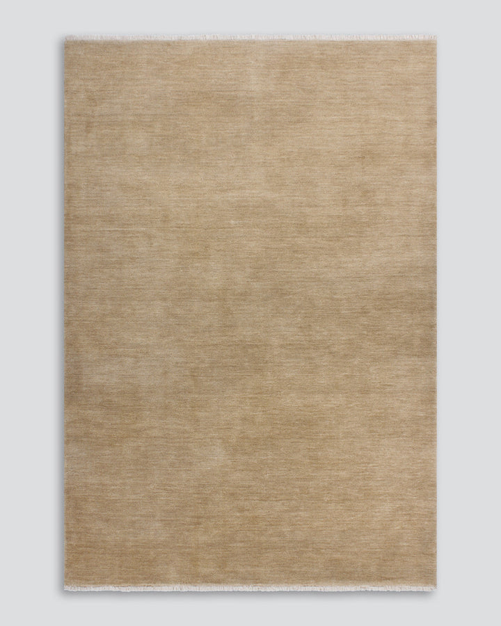 Sandringham Floor Rug Create a sophisticated sanctuary with the dense, sumptuous pile of the Sandringham. Soft and supportive underfoot, this floor rug is handknotted from 100% wool, featuring a cut pile and delicate fringing at both ends. The neutral fog