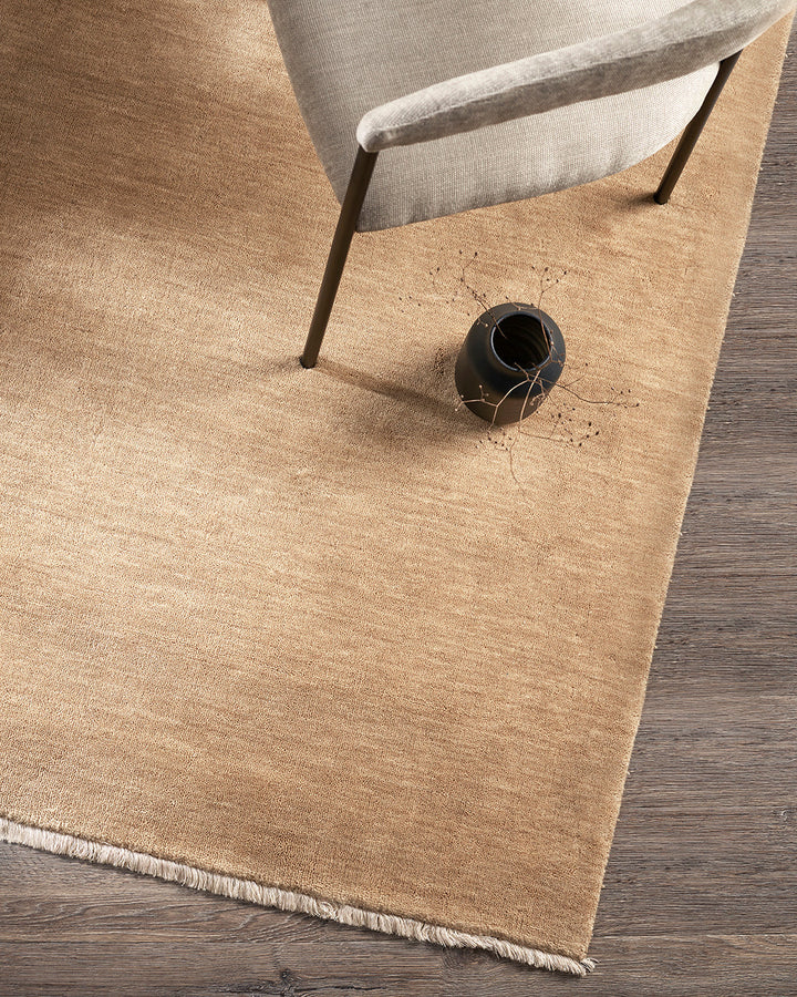 Sandringham Floor Rug Create a sophisticated sanctuary with the dense, sumptuous pile of the Sandringham. Soft and supportive underfoot, this floor rug is handknotted from 100% wool, featuring a cut pile and delicate fringing at both ends. The neutral fog