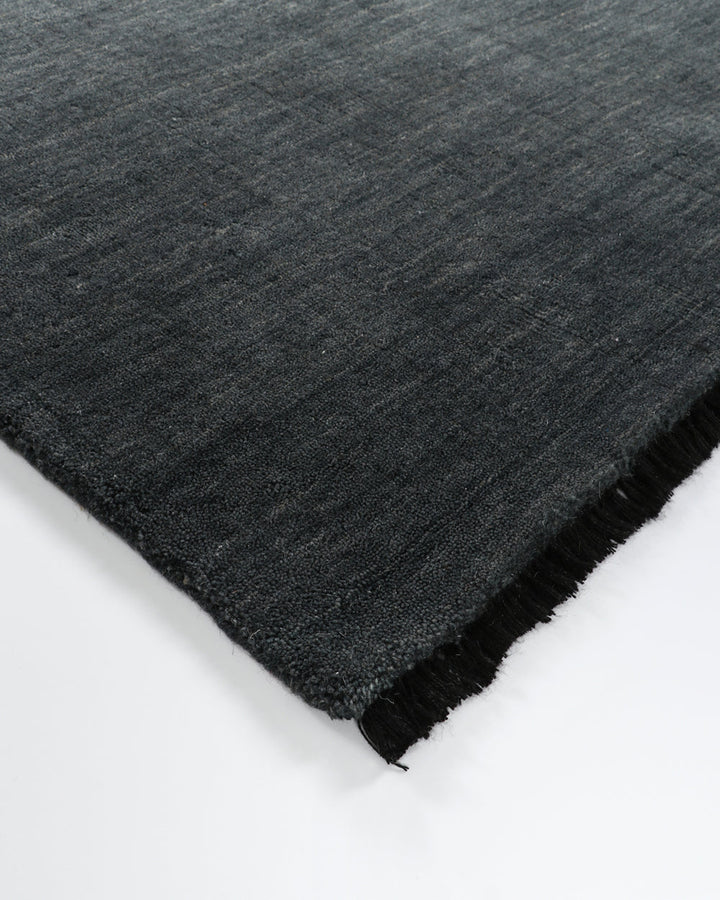 Sandringham Floor Rug Create a sophisticated sanctuary with the dense, sumptuous pile of the Sandringham. Soft and supportive underfoot, this floor rug is handknotted from 100% wool, featuring a cut pile and delicate fringing at both ends. The neutral fog