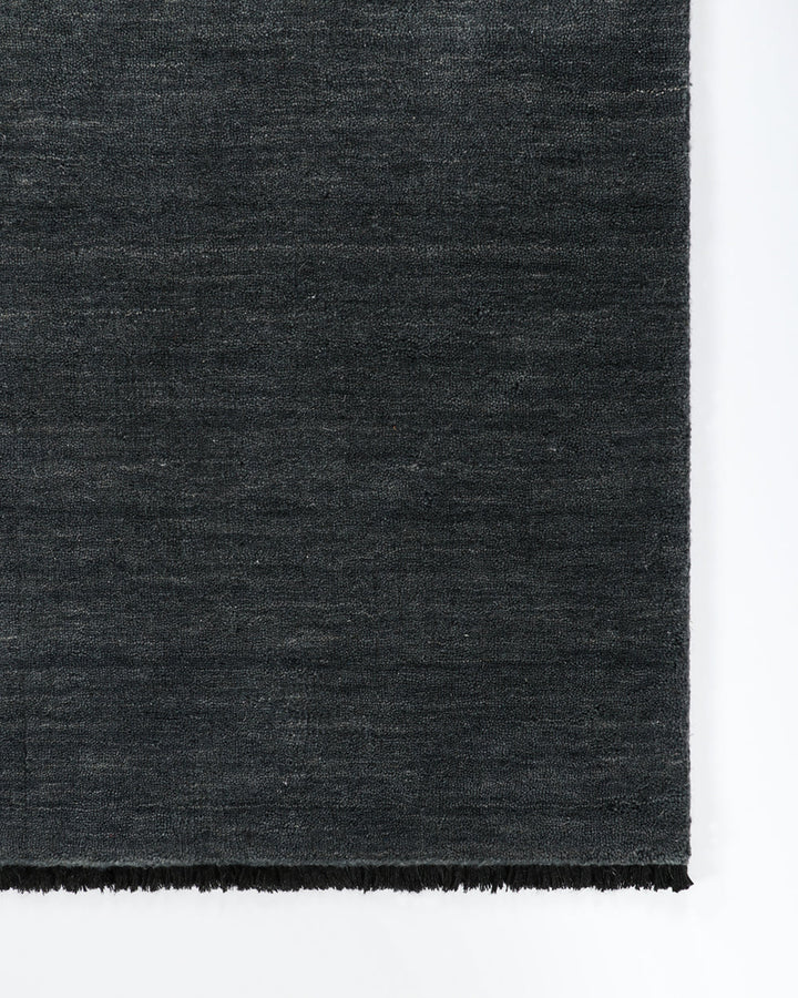 Sandringham Floor Rug Create a sophisticated sanctuary with the dense, sumptuous pile of the Sandringham. Soft and supportive underfoot, this floor rug is handknotted from 100% wool, featuring a cut pile and delicate fringing at both ends. The neutral fog