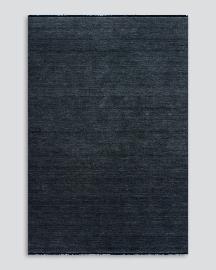 Sandringham Floor Rug Create a sophisticated sanctuary with the dense, sumptuous pile of the Sandringham. Soft and supportive underfoot, this floor rug is handknotted from 100% wool, featuring a cut pile and delicate fringing at both ends. The neutral fog