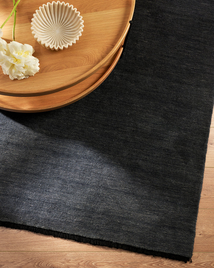 Sandringham Floor Rug Create a sophisticated sanctuary with the dense, sumptuous pile of the Sandringham. Soft and supportive underfoot, this floor rug is handknotted from 100% wool, featuring a cut pile and delicate fringing at both ends. The neutral fog