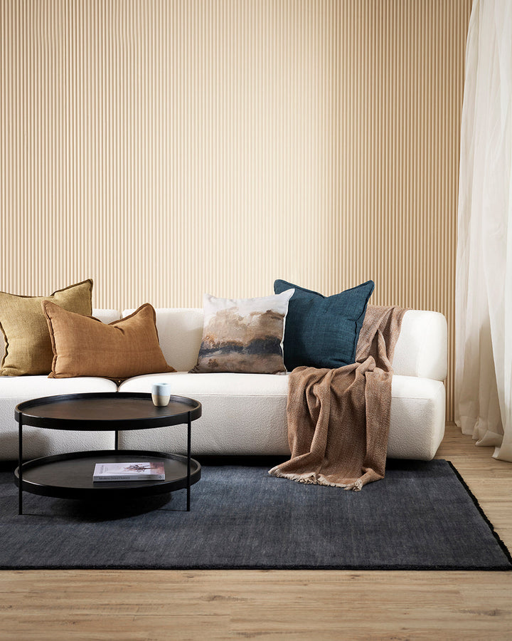 Sandringham Floor Rug Create a sophisticated sanctuary with the dense, sumptuous pile of the Sandringham. Soft and supportive underfoot, this floor rug is handknotted from 100% wool, featuring a cut pile and delicate fringing at both ends. The neutral fog