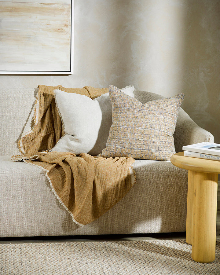 Sari Cushion Constructed from artisanal woven fabric, the Sari is handcrafted using a stunning blend of wild tussar silk and linen. Featuring a subtle pattern in earthy shades of biscuit, ecru and peat, the Sari adds an understated textural aesthetic to a