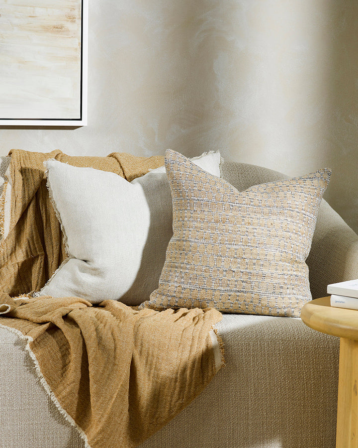 Sari Cushion Constructed from artisanal woven fabric, the Sari is handcrafted using a stunning blend of wild tussar silk and linen. Featuring a subtle pattern in earthy shades of biscuit, ecru and peat, the Sari adds an understated textural aesthetic to a