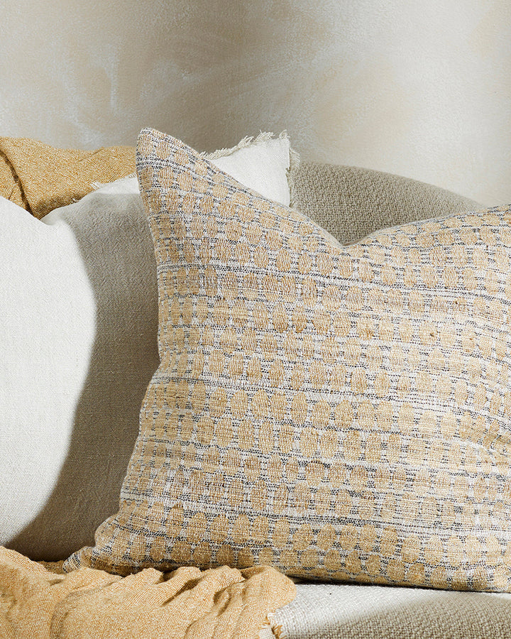 Sari Cushion Constructed from artisanal woven fabric, the Sari is handcrafted using a stunning blend of wild tussar silk and linen. Featuring a subtle pattern in earthy shades of biscuit, ecru and peat, the Sari adds an understated textural aesthetic to a