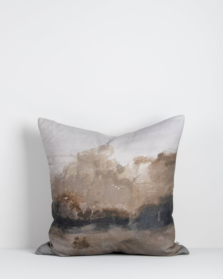 Seraphine Cushion A soft, abstract landscape is captured with quiet elegance in the design of our Seraphine cushion. Hand-painted impressionist forms in ink and taupe create a diffused effect, that brings warmth and a moody ambience to living spaces. Styl