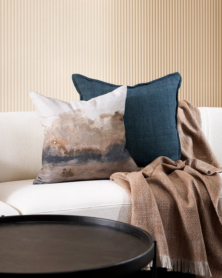 Seraphine Cushion A soft, abstract landscape is captured with quiet elegance in the design of our Seraphine cushion. Hand-painted impressionist forms in ink and taupe create a diffused effect, that brings warmth and a moody ambience to living spaces. Styl