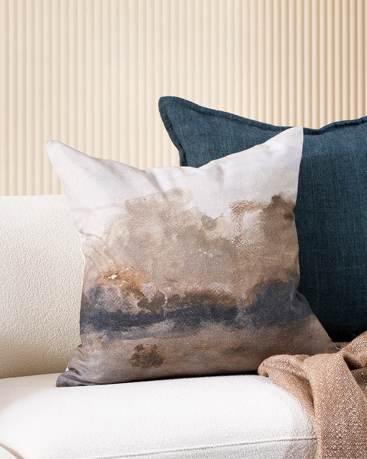 Seraphine Cushion A soft, abstract landscape is captured with quiet elegance in the design of our Seraphine cushion. Hand-painted impressionist forms in ink and taupe create a diffused effect, that brings warmth and a moody ambience to living spaces. Styl