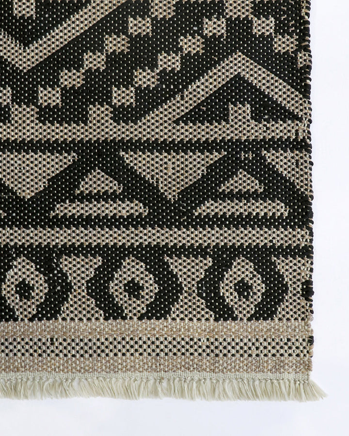 Sifiso Floor Rug Handwoven from durable polypropylene, the Sifiso outdoor rug is finished with a relaxed, hand-knotted fringe edging. Soft underfoot, the ethnic-inspired design looks stunning on any surface and can be used in and outdoors interchangeably.